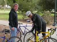DSCN3398  Sean La Motte, volunteer bike mechanic,  adjusts Geoff Berry's cool yellow bike