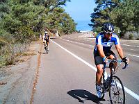 thursday.7.26 03  Eric blows past a SDBC club rider climbing up the outside Torrey Pines hill.
